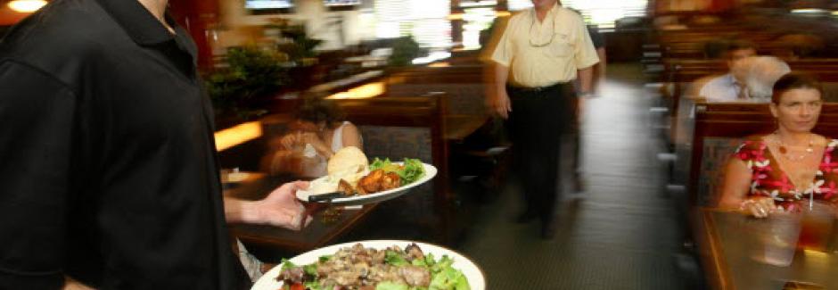 Waiter delivering food