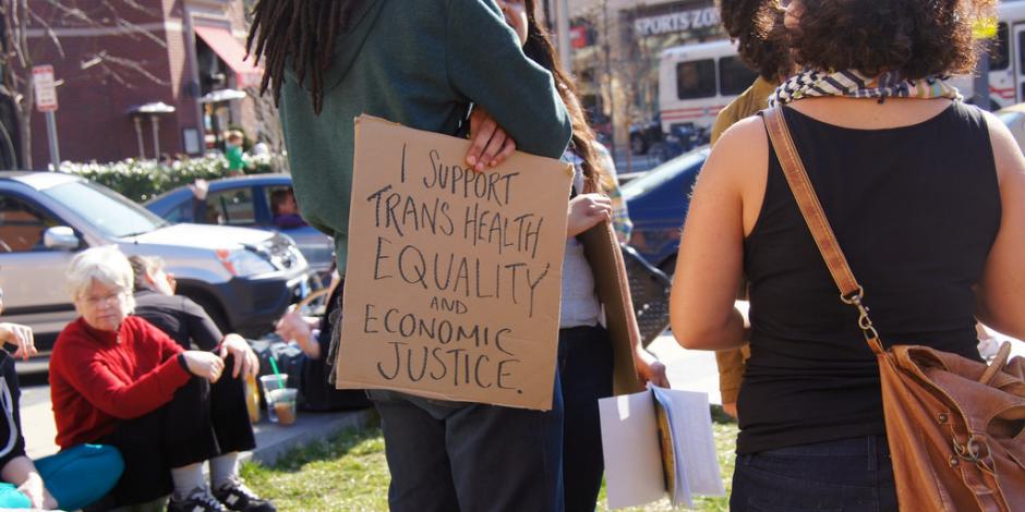 Individual holding a sign