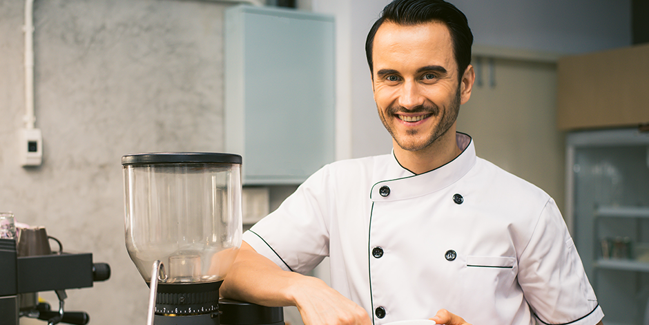 Chef standing by mixer