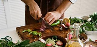 Team member cutting veggies