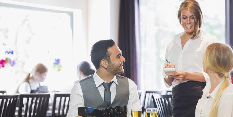 Waitress talking to customers