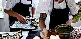 Two people working at catering event