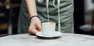 Person serving coffee