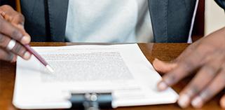 Man signing paper work
