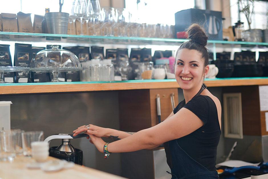 Young person pressing coffee