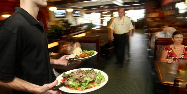 Waiter delivering food