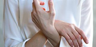 Person holding their hands close to them